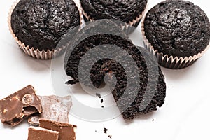Chocolate muffins on a gray background.