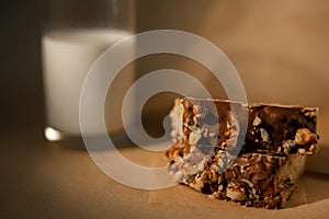 Chocolate muffins with milk on a dark background. Cocoa powder, chocolate muffin and a glass of milk