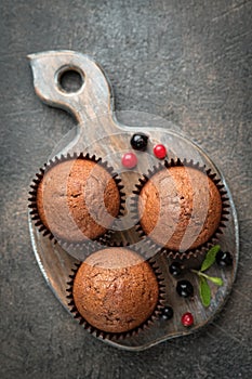 Chocolate muffins on a portioned board