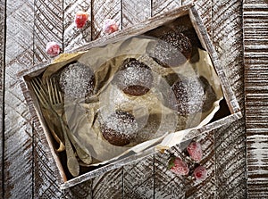 Chocolate muffins serving in a wooden box