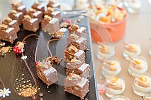 Chocolate Nut Brownie Cake decorated with Strawberries in Luxury Restaurant for Brunch, Buffet Concept