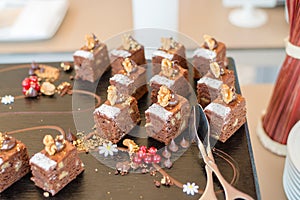 Chocolate Nut Brownie Cake decorated with Strawberries in Luxury Restaurant for Brunch, Buffet Concept