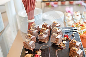 Chocolate Nut Brownie Cake decorated with Strawberries in Luxury Restaurant for Brunch, Buffet Concept