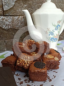 Chocolate nut cake in front of a tea set