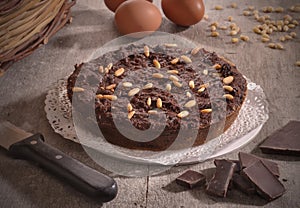 Chocolate nuts cake on rustic kitchen