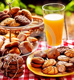 Chocolate oatmeal cookies, sand heart shape cake with orange juice