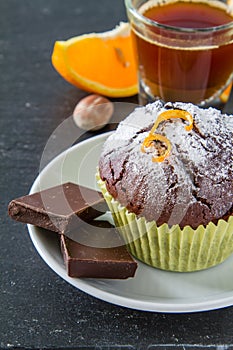 Chocolate and orange cupcake with coffee