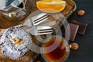 Chocolate and orange cupcake with coffee