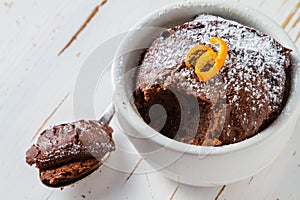 Chocolate and orange cupcake with coffee