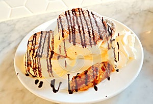 Chocolate pancake with cream