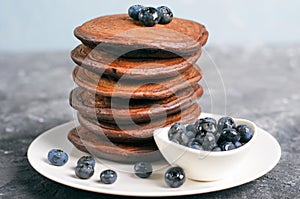 Chocolate Pancakes with Blueberry on grey background, Homemade Dessert, Sweet Breakfast