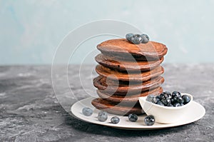 Chocolate Pancakes with Blueberry on grey background, Homemade Dessert, Sweet Breakfast