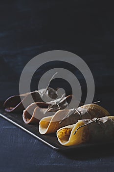 Chocolate pancakes on rusty tinwere on scratched blackboard