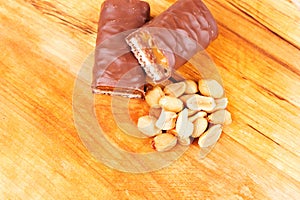 Chocolate peanut butter energy bar on the wooden board