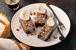 Chocolate pecan pie bars with caramel sauce