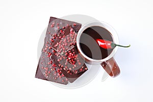 Chocolate with pepper and hot chocolate drink with pepper, isolated on white background