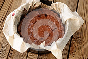 Chocolate pie dough in papered cake pan