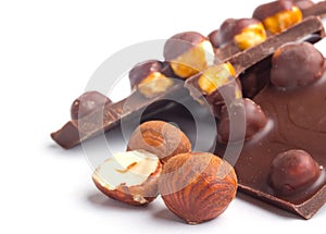 Chocolate piles with filberts on white