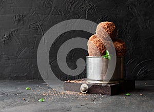 Chocolate potato cake on a black background