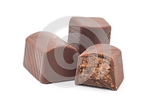 Chocolate pralines with dark nougat filling isolated on white