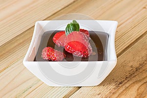 Chocolate pudding with strawberries