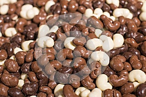 Chocolate raisins and nuts pile sweet background