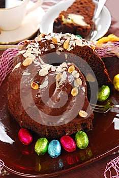 Chocolate ring cake with almonds and nuts topping for easter
