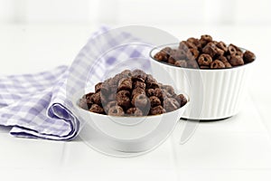 Chocolate Ring Cereal on White Bowl