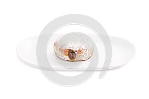 Chocolate round donut displayed in a white plate