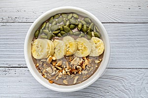 Chocolate smoothie bowl Chocolate , avocado , banana , almond milk topped with sliced banana, Pumpkin seeds, chopped  nuts and