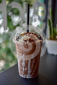 Chocolate smoothie milkshake with jar in cafe