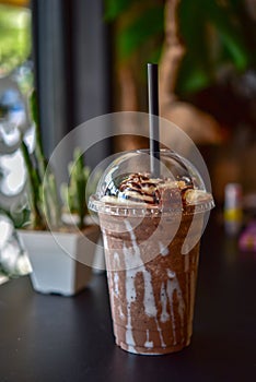 Chocolate smoothie milkshake with jar in cafe