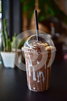 Chocolate smoothie milkshake with jar in cafe photo