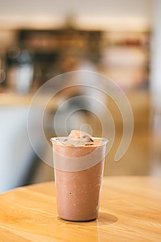 Chocolate smoothies milkshake on wood background