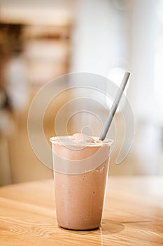 Chocolate smoothies milkshake on wood background