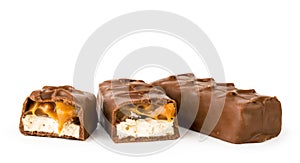 Chocolate Snickers and two halves on a white, isolated.