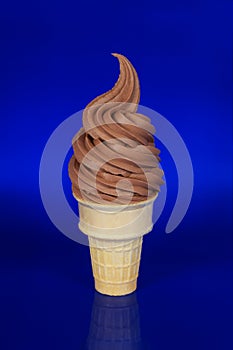 Chocolate Soft Serve Ice Cream on a Blue Background