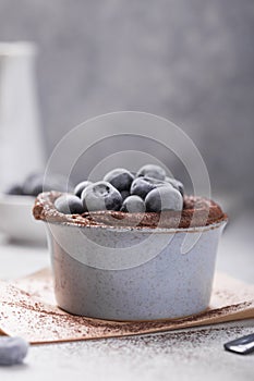 Chocolate Souffle with frozen blueberry . French traditional dessert