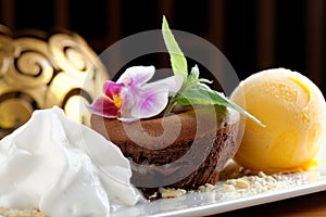 Chocolate souffle with mango ice cream