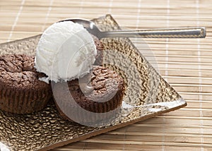 Chocolate souffle and vanilla ice cream on table,