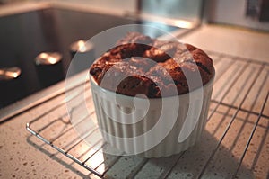 A Chocolate Souffle in a White Ramekin