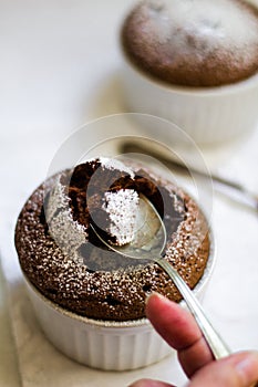 Chocolate soufle in ramekins and marble background