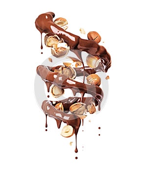 Chocolate splashes in spiral shape with crushed hazelnuts on a white background photo