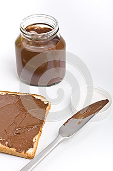 Chocolate spread jar and a toast