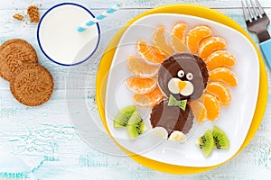 Chocolate spread sandwich lion with fresh fruit and milk for kids breakfast