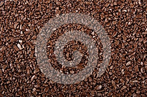 Chocolate sprinkles background. View of granulated chocolate photo