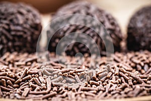 Chocolate sprinkles, ingredient to make Brazilian brigadeiro and chocolate covered sprinkles. blurred background chocolate photo
