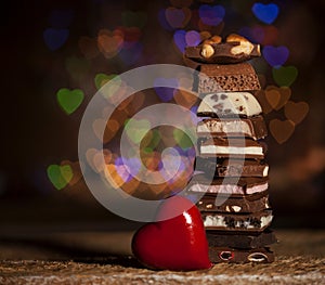 Chocolate stack on colorful bokeh background