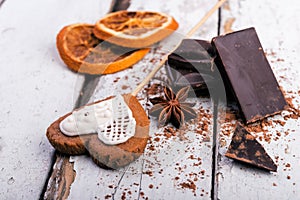 Chocolate and star anise on rustic table