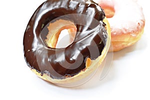 Chocolate and strawberry cream donuts on white background